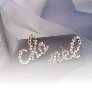 Pearl Script Earrings..bling bling.. affordable style. Crystals and faux pearls